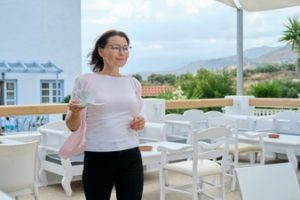 mature-beautiful-woman-walking-with-cup-coffee-outdoor-restaurant-resort-hotel-beautiful-picturesque-mountain-landscape-recreation-leisure-summer-weekend-tourism-travel-middle-aged-people_116407-10 (1)