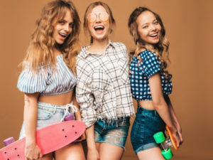 three-young-stylish-sexy-smiling-beautiful-girls-with-colorful-penny-skateboards-women-summer-checkered-shirt-clothes-posing-sunglasses-positive-models-having-fun_158538-4631